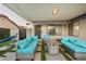 Covered patio featuring a modern fire pit, comfortable seating, and a relaxing hammock at 4689 Kristen Ln, Las Vegas, NV 89121