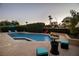 Inviting swimming pool surrounded by lush greenery and comfortable seating areas at 4689 Kristen Ln, Las Vegas, NV 89121