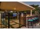 Inviting outdoor pool area with bar seating, lush landscaping, and a relaxing atmosphere at 4689 Kristen Ln, Las Vegas, NV 89121