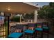 Outdoor pool area with stone bar, comfortable seating, and a relaxing tropical vibe at 4689 Kristen Ln, Las Vegas, NV 89121