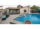 Gorgeous pool area with pool steps, inviting lounge area and well-maintained backyard landscaping at 4689 Kristen Ln, Las Vegas, NV 89121