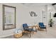 Sitting room with blue chairs and natural light at 4689 Kristen Ln, Las Vegas, NV 89121