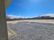 Large, undeveloped backyard, enclosed by a tall block wall fence for added privacy at 5051 Fairmont St, Pahrump, NV 89061