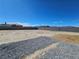 Spacious backyard surrounded by a block wall fence offering privacy and potential for customization at 5051 Fairmont St, Pahrump, NV 89061