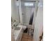 Bright bathroom features a marble-top vanity and a shower-tub combination with white subway tile surround at 5051 Fairmont St, Pahrump, NV 89061