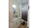 Bright bathroom featuring a vanity with granite counters, a toilet, and a shower with a curtain at 5051 Fairmont St, Pahrump, NV 89061
