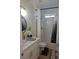 Bright bathroom features a marble-top vanity and a shower-tub combination with white subway tile surround at 5051 Fairmont St, Pahrump, NV 89061