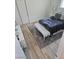Bedroom with wood floors, a gray rug, and a bed with white headboard at 5051 Fairmont St, Pahrump, NV 89061