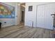 Bedroom with wood floors, open door, and a closet with bi-fold doors at 5051 Fairmont St, Pahrump, NV 89061