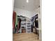 This walk-in closet provides ample storage with shelving, hanging rods, and convenient storage at 5051 Fairmont St, Pahrump, NV 89061