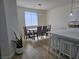 Bright dining room with neutral colors and sleek light fixture offers a modern aesthetic at 5051 Fairmont St, Pahrump, NV 89061