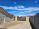 Gated driveway leading to a desert home with a spacious lot and block wall fencing at 5051 Fairmont St, Pahrump, NV 89061