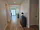 Elegant entryway with wood-look flooring, neutral paint and a stylish wood cabinet at 5051 Fairmont St, Pahrump, NV 89061