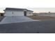 Charming single-story house with a spacious driveway, two-car garage, and desert landscaping at 5051 Fairmont St, Pahrump, NV 89061