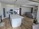 Bright kitchen featuring white cabinetry, stainless appliances and a large island with seating at 5051 Fairmont St, Pahrump, NV 89061