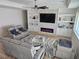 A comfortable living room with an electric fireplace and built-in shelves creating an inviting space at 5051 Fairmont St, Pahrump, NV 89061