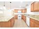 Well-lit kitchen showcasing granite counters, a central island, and ample cabinetry at 5087 Orinda Ave, Las Vegas, NV 89120