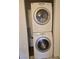 Close-up of stacked washer and dryer unit inside the home at 519 Fir St # G, Boulder City, NV 89005