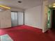 View of the living room showcasing large sliding door to balcony and neutral wall colors at 519 Fir St # G, Boulder City, NV 89005