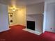 Bright living room featuring a fireplace and in-unit stacked washer and dryer at 519 Fir St # G, Boulder City, NV 89005