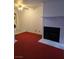 Inviting living room featuring a cozy fireplace and convenient in-unit washer/dryer at 519 Fir St # G, Boulder City, NV 89005