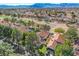 Aerial view of a community with lush greenery, showcasing beautiful homes and golf course fairways at 5429 Painted Sunrise Dr, Las Vegas, NV 89149