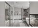 Modern bathroom featuring a glass enclosed shower and a soaking tub at 5429 Painted Sunrise Dr, Las Vegas, NV 89149