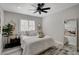 Cozy bedroom with neutral decor and an oversized mirror at 5429 Painted Sunrise Dr, Las Vegas, NV 89149