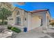 Beautiful exterior of the home with a covered entryway, red tile roof, and well-maintained landscaping at 5429 Painted Sunrise Ave, Las Vegas, NV 89149