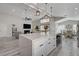 Spacious kitchen with a big island overlooking the living and dining area at 5429 Painted Sunrise Dr, Las Vegas, NV 89149