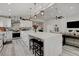 Bright, open kitchen features a large island with seating and modern appliances at 5429 Painted Sunrise Dr, Las Vegas, NV 89149
