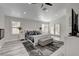 Large bedroom with a ceiling fan, grey color accents, and private backyard access at 5429 Painted Sunrise Dr, Las Vegas, NV 89149