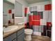 Well-lit bathroom featuring a large mirror, modern vanity, and colorful shower curtain at 5457 Jackpot Winner Ln # 101, Las Vegas, NV 89122