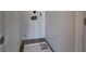 Small laundry room with tile floor, washer hookups, and white walls at 5457 Jackpot Winner Ln # 101, Las Vegas, NV 89122