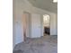 Main bedroom leading into the ensuite bathroom with modern fixtures and gray accent colors at 5457 Jackpot Winner Ln # 101, Las Vegas, NV 89122