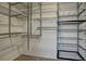 Walk-in closet featuring metal shelving and ample storage space for clothes and accessories at 5457 Jackpot Winner Ln # 101, Las Vegas, NV 89122