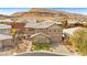 Stunning aerial view of a two-story home with a pool and mountain backdrop at 5523 Kyle Peak Ct, Las Vegas, NV 89135