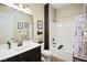 Bathroom featuring a shower-tub combo, a large vanity, and modern fixtures at 5523 Kyle Peak Ct, Las Vegas, NV 89135