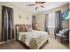 This bedroom has a TV and natural light to add to the room's beauty at 5523 Kyle Peak Ct, Las Vegas, NV 89135