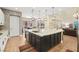 Kitchen boasts granite countertops, modern appliances and a large island that offers space for seating and storage at 5523 Kyle Peak Ct, Las Vegas, NV 89135