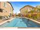 Relaxing swimming pool with clear water and stylish stone accents creates a serene backyard oasis at 5523 Kyle Peak Ct, Las Vegas, NV 89135