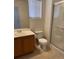 Well-lit bathroom with a walk-in shower, toilet and vanity at 5564 Ness Ave, Las Vegas, NV 89118