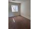 Carpeted bedroom with natural light from a bright window at 5564 Ness Ave, Las Vegas, NV 89118