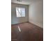 A cozy bedroom with a window allowing natural light to illuminate the brown carpet at 5564 Ness Ave, Las Vegas, NV 89118