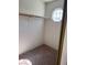 Walk-in closet featuring a unique octagon window and ample storage space at 5564 Ness Ave, Las Vegas, NV 89118