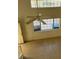 Open living room showing a ceiling fan and large windows allowing ample natural light at 5564 Ness Ave, Las Vegas, NV 89118