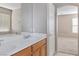 Bathroom featuring a double sink vanity and a large mirror, offering a comfortable space at 5967 Grechetto Ct, Las Vegas, NV 89141