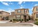 Charming two-story home featuring a tile roof, two car garage and landscaped front yard at 5967 Grechetto Ct, Las Vegas, NV 89141