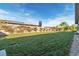 Expansive backyard with verdant lawn and perimeter privacy features, creating a peaceful and secluded outdoor retreat at 6130 Pebble Glen, Las Vegas, NV 89149