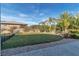 Lush backyard showcasing green grass, mature landscaping, and privacy fencing, offering a serene outdoor space at 6130 Pebble Glen, Las Vegas, NV 89149